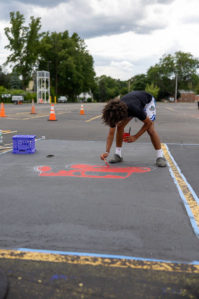 students painting their parking spot