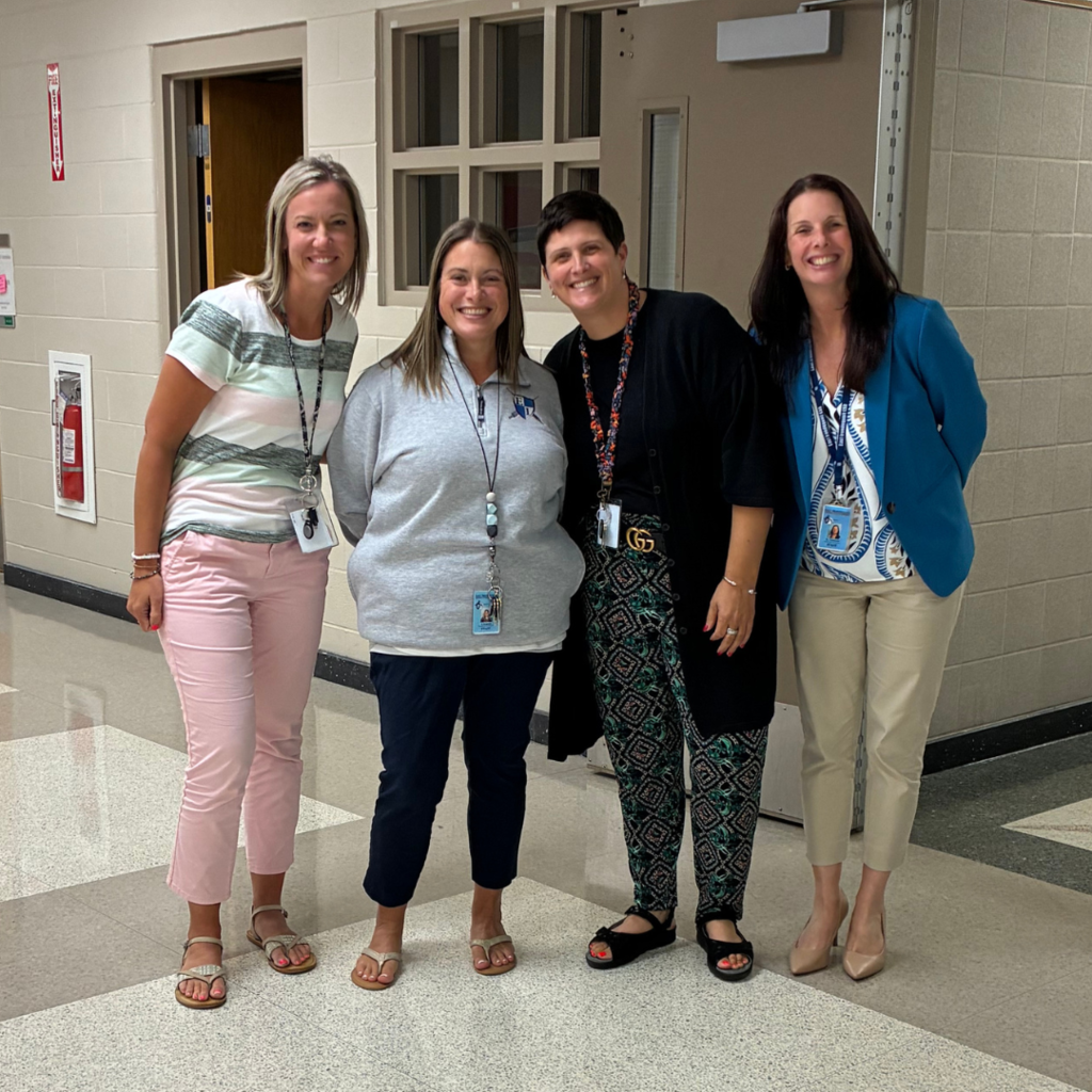 administrative staff pose for a photo