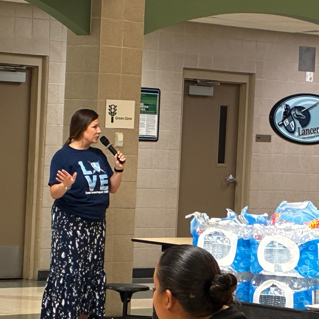 staff member talks to families on the mic