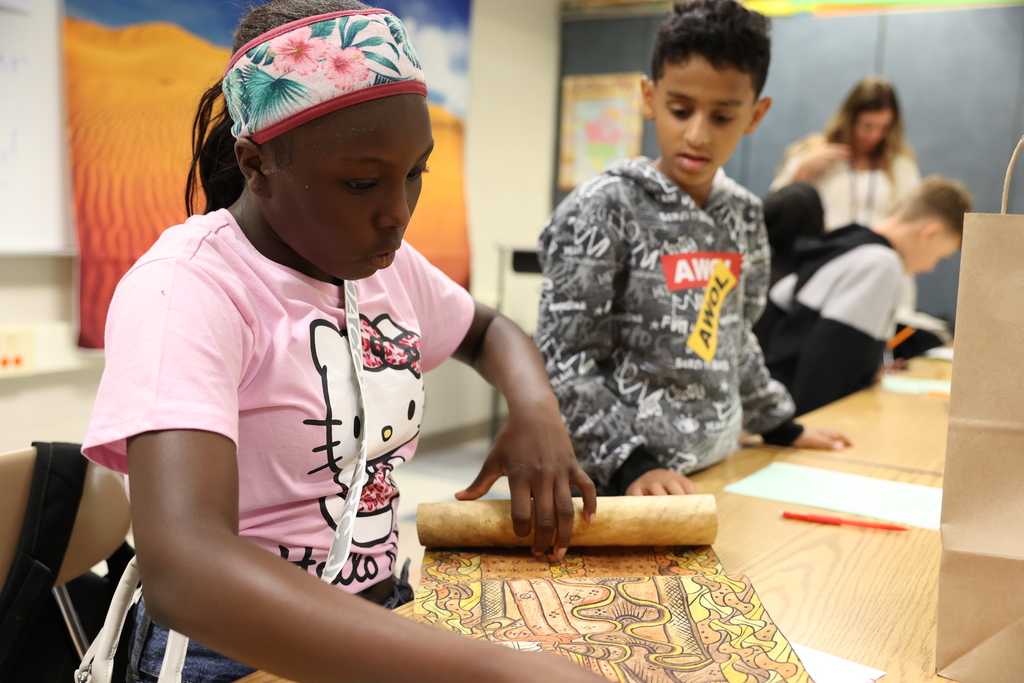 student is amazed by scroll they roll out