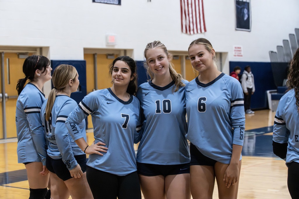 Teammates pose in the gym