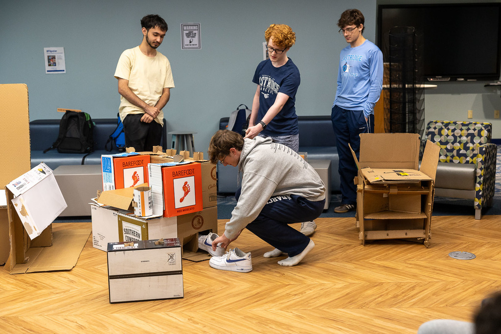 students with their cardboard chairs