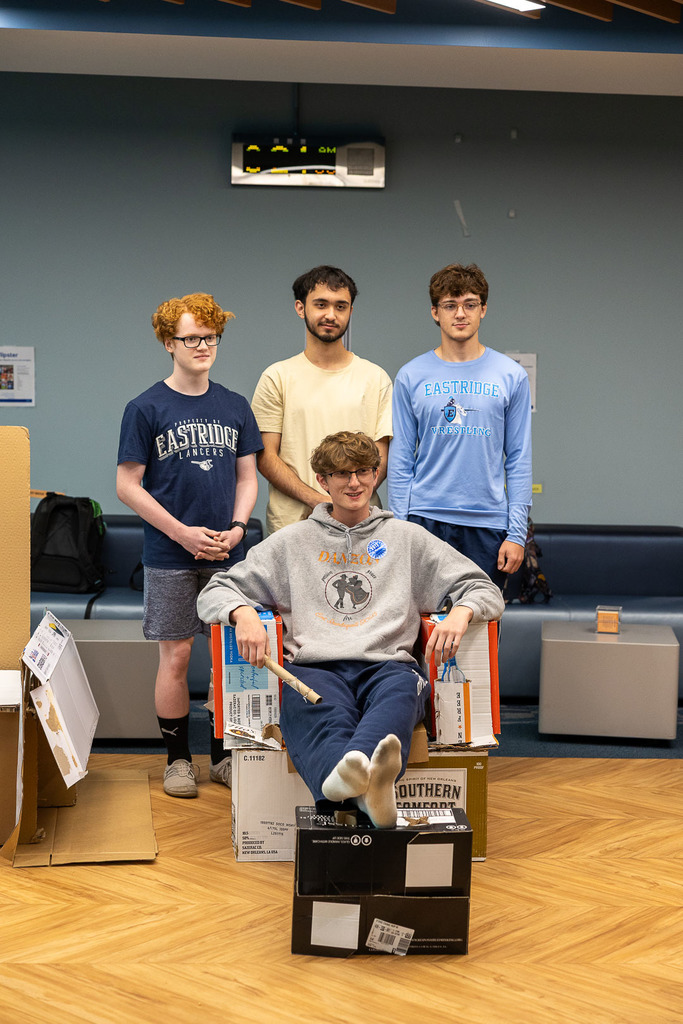 students with their cardboard chairs