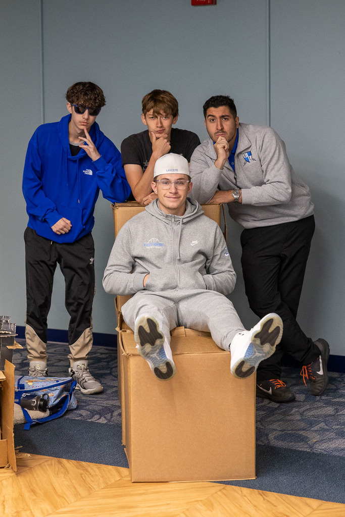 students with their cardboard chairs