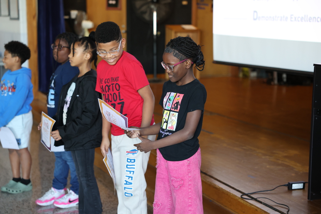 Students smile with certificates 