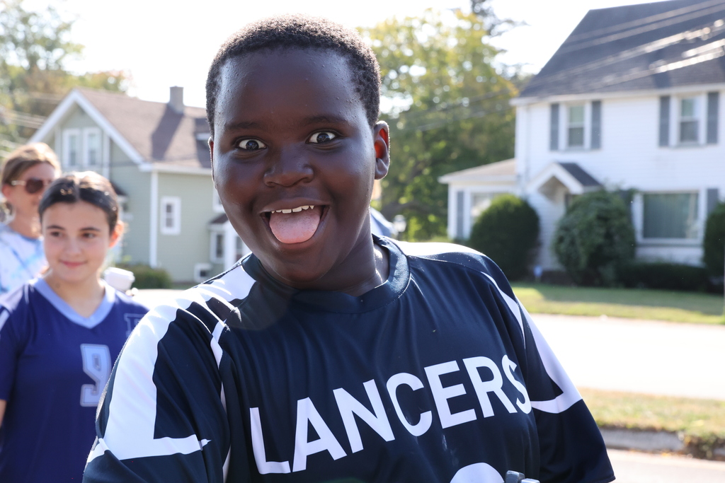 student sticks tongue out with Lancers jersey
