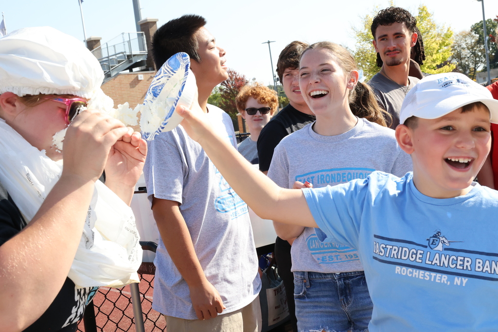 Student pies senior while students laugh