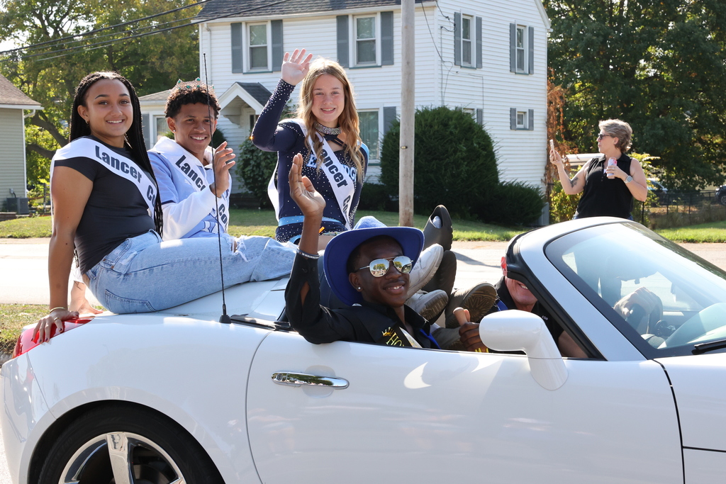 homecoming court sits in convertible