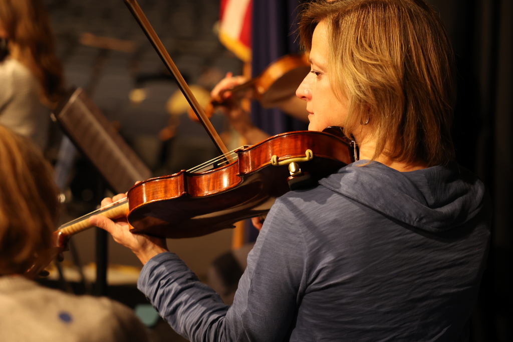teacher plays violin