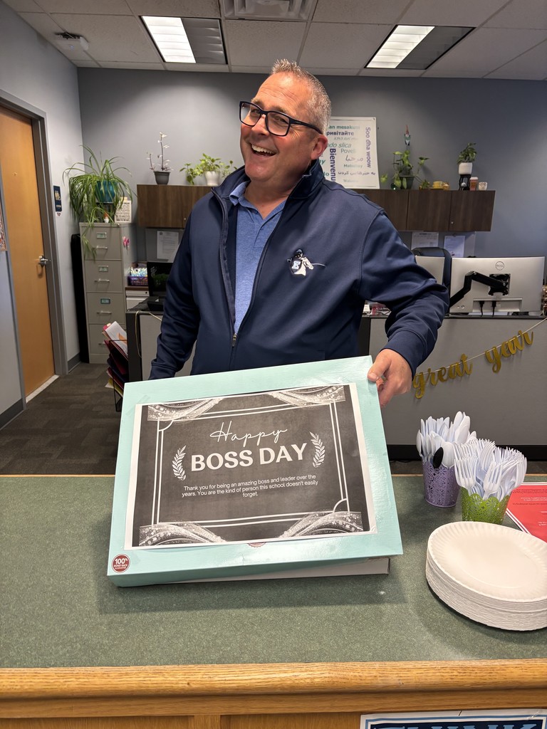 Picture of Mr Roach with a cake for Boss's Day