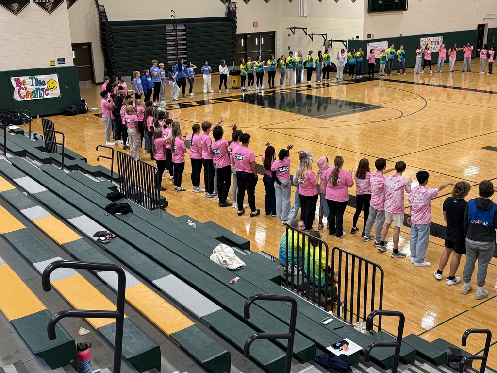 Students stand in a giant circle in the gym with other link leaders