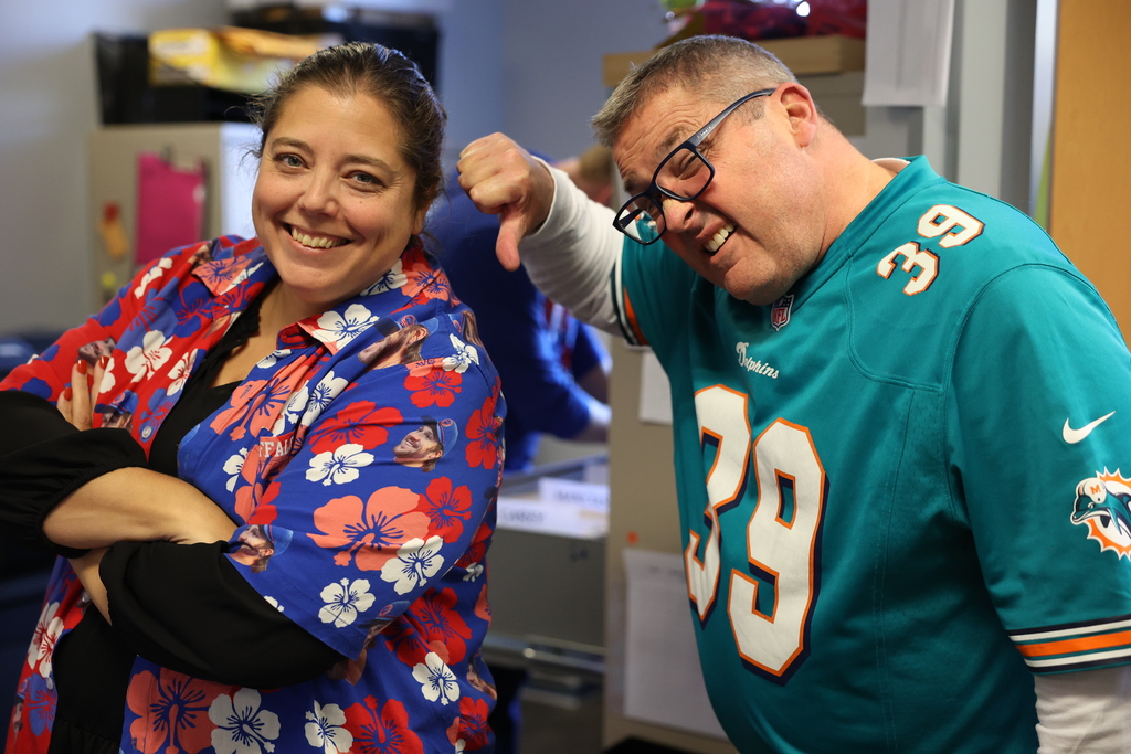 principal and secretary wear bills and dolphins nfl gear
