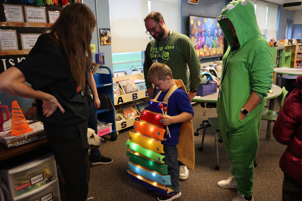 student shows staff his lite costume