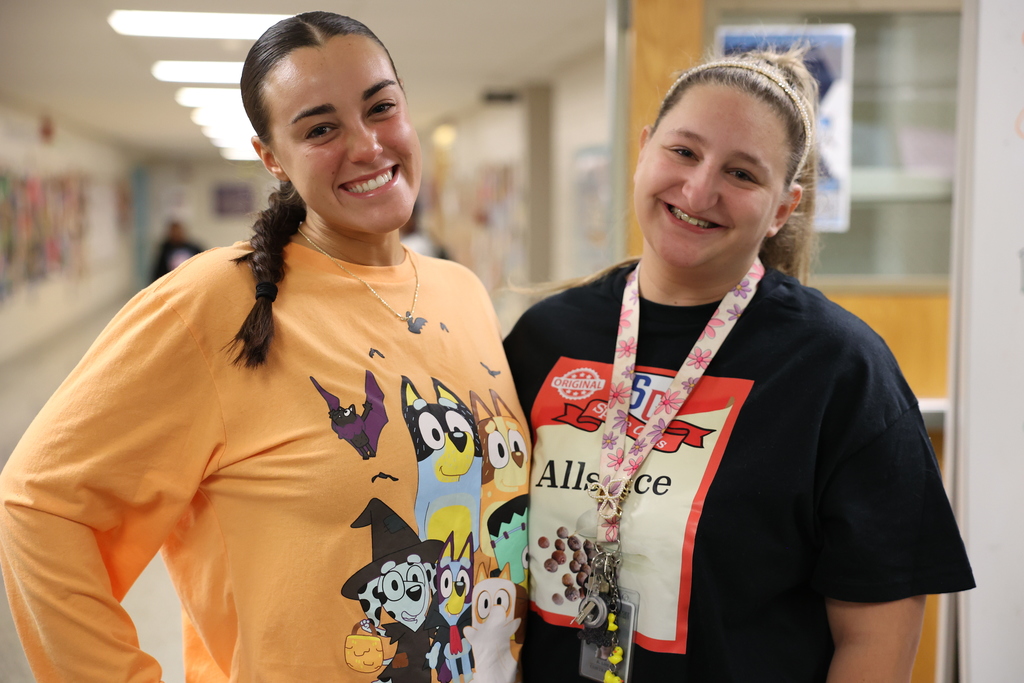 Staff poses in costumes