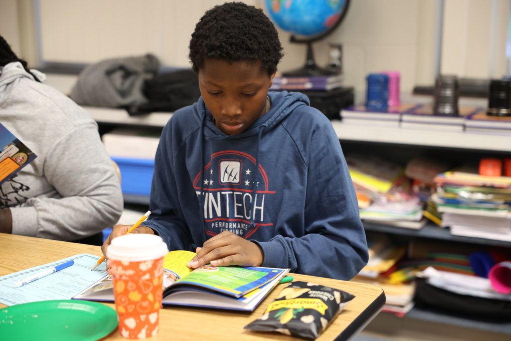 student looks at book