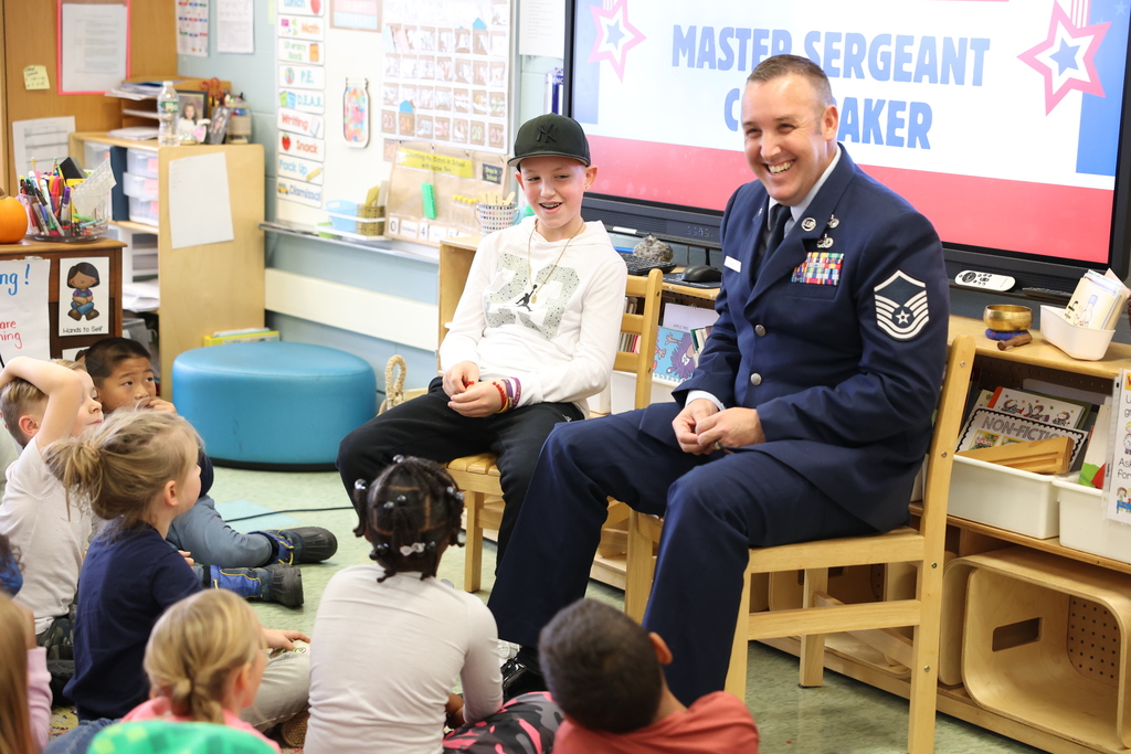 guest speaker smiles with students