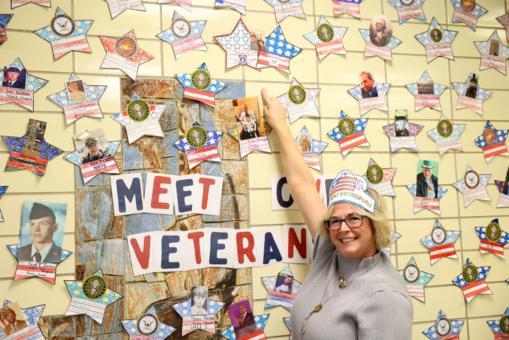 Deb Crocetti points to her and her late husbands star