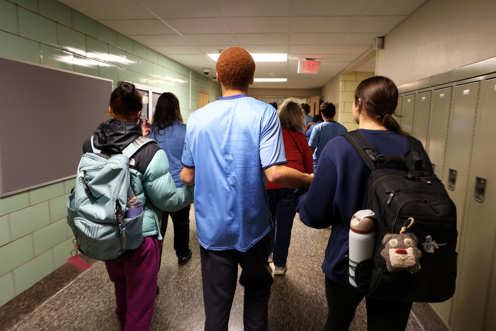 students walk together in the hall