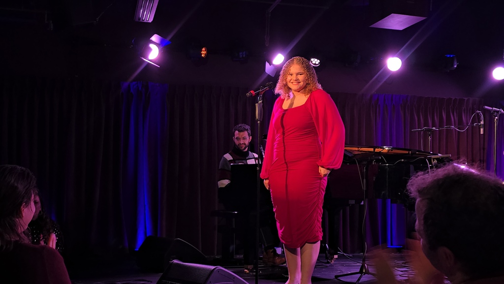 Ella smiles on stage