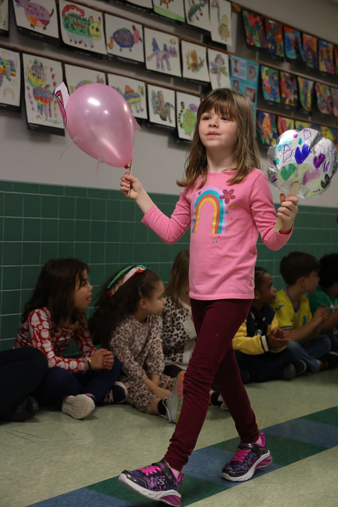 students smile during school parade 