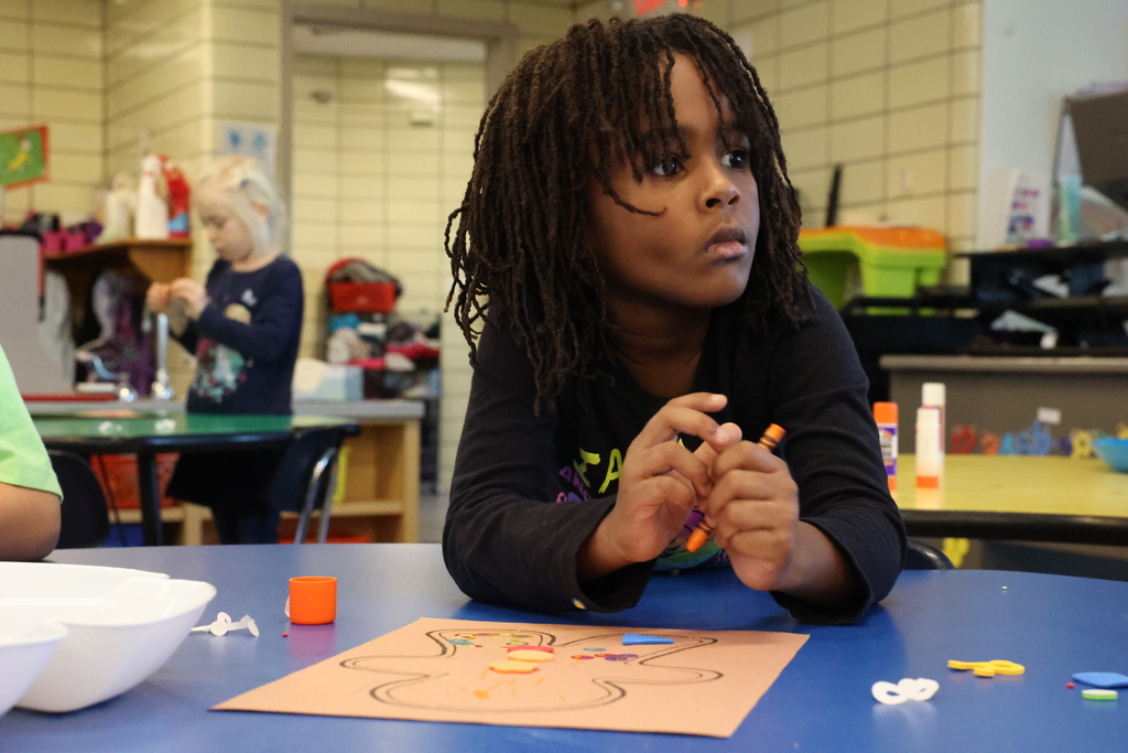 Student works on gingerbread craft