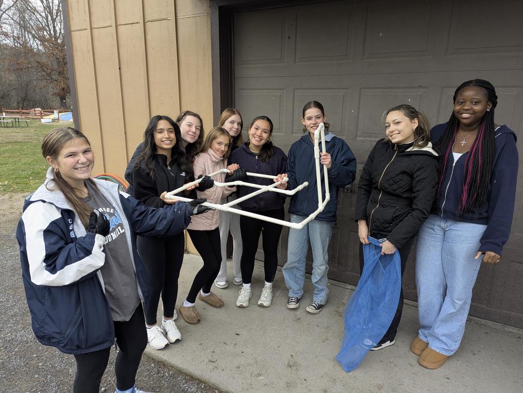students pose for a photo during team building