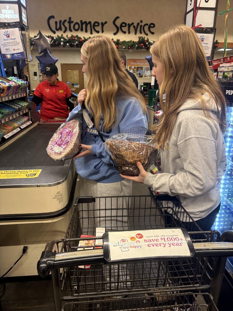 students put meat on the belt in the check out line