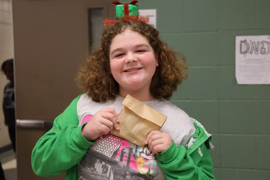 Student holds cookie for high honor roll
