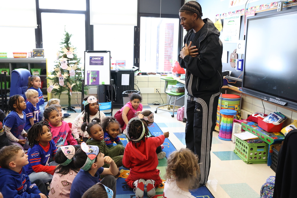 students listen to Jamarcus in the classroom