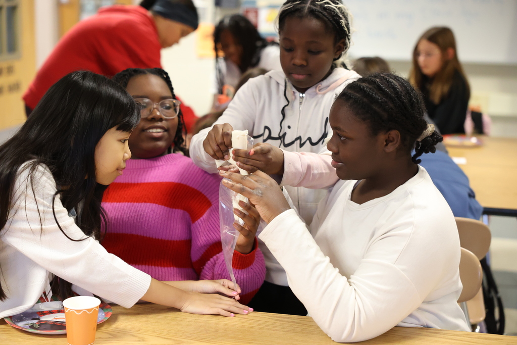 students put frosting in a bag