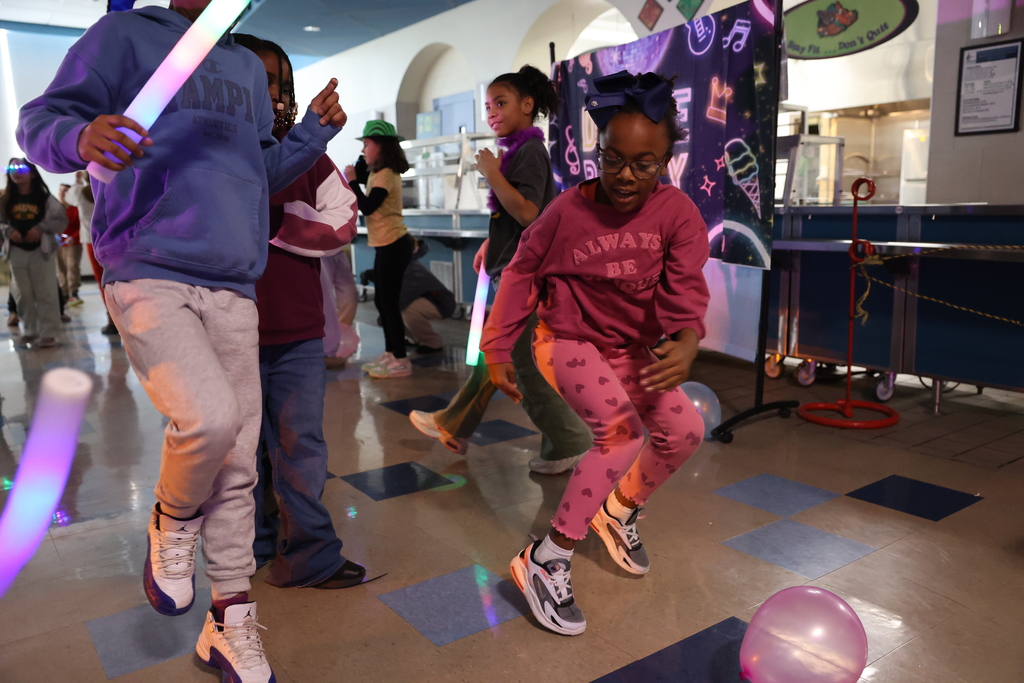 student dances with sneakers