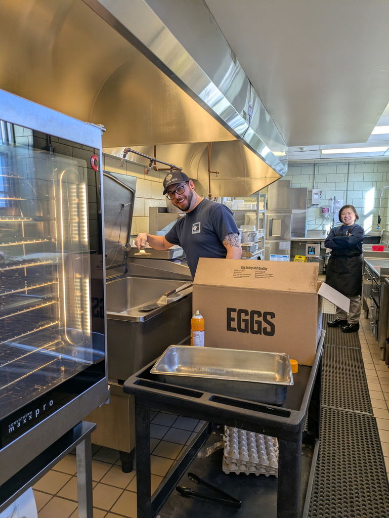 cafeteria workers prepare meals