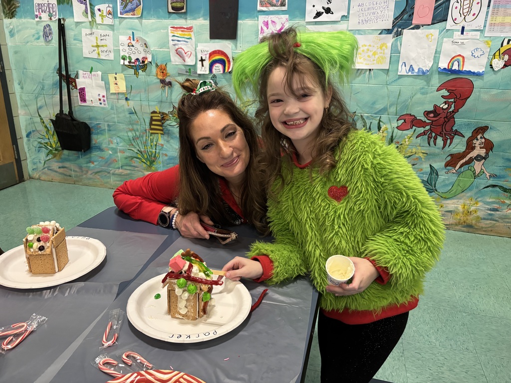 student and parent pose for a pictures