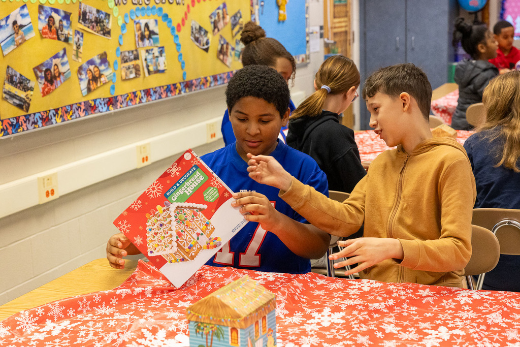 students making gingerbread houses