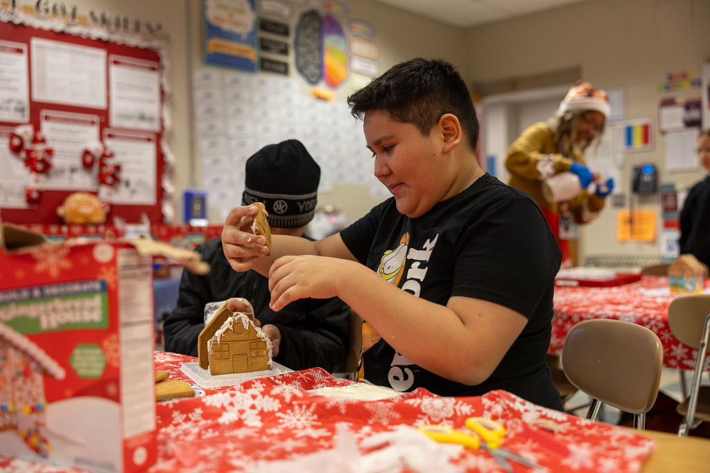 students making gingerbread houses