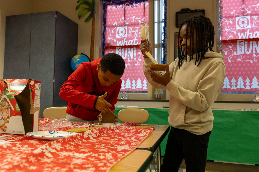 students making gingerbread houses