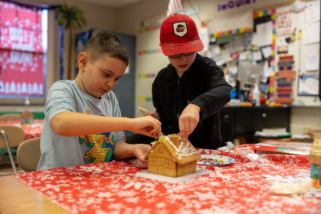 students making gingerbread houses