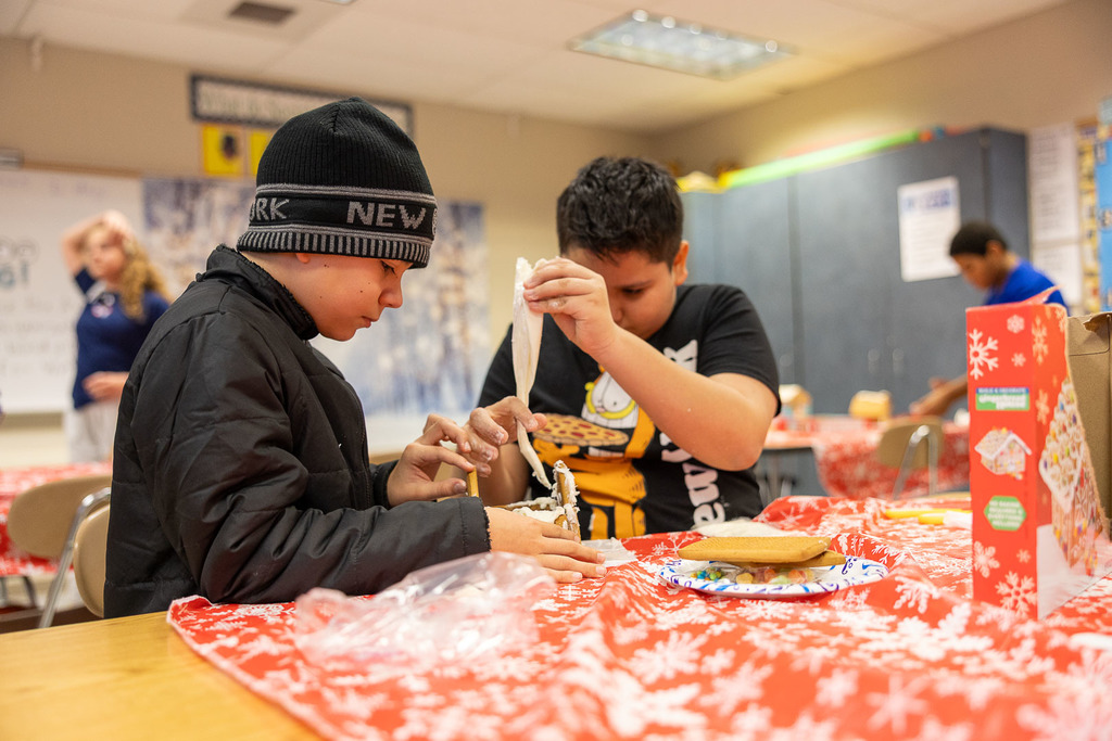 students making gingerbread houses