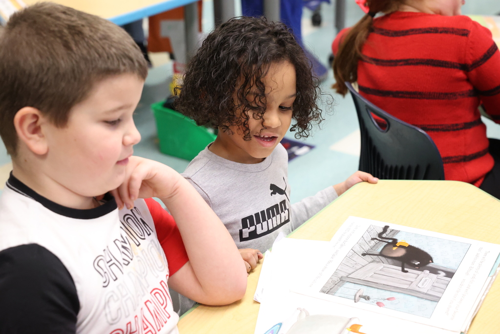 students read a book together