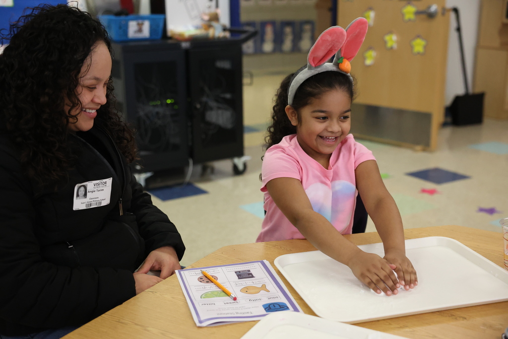 student and parent smile during feel activity