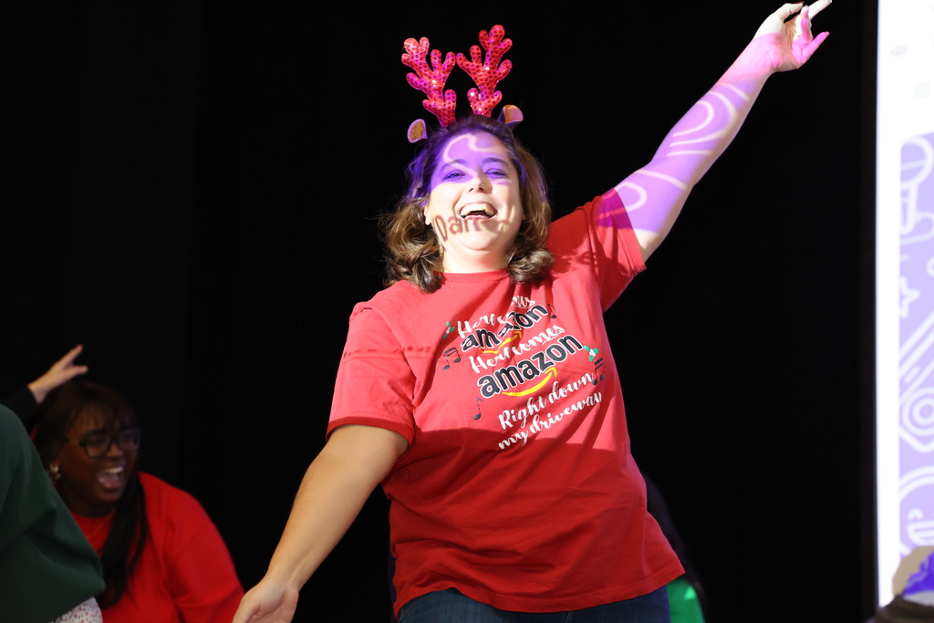 Teachers dance on stage
