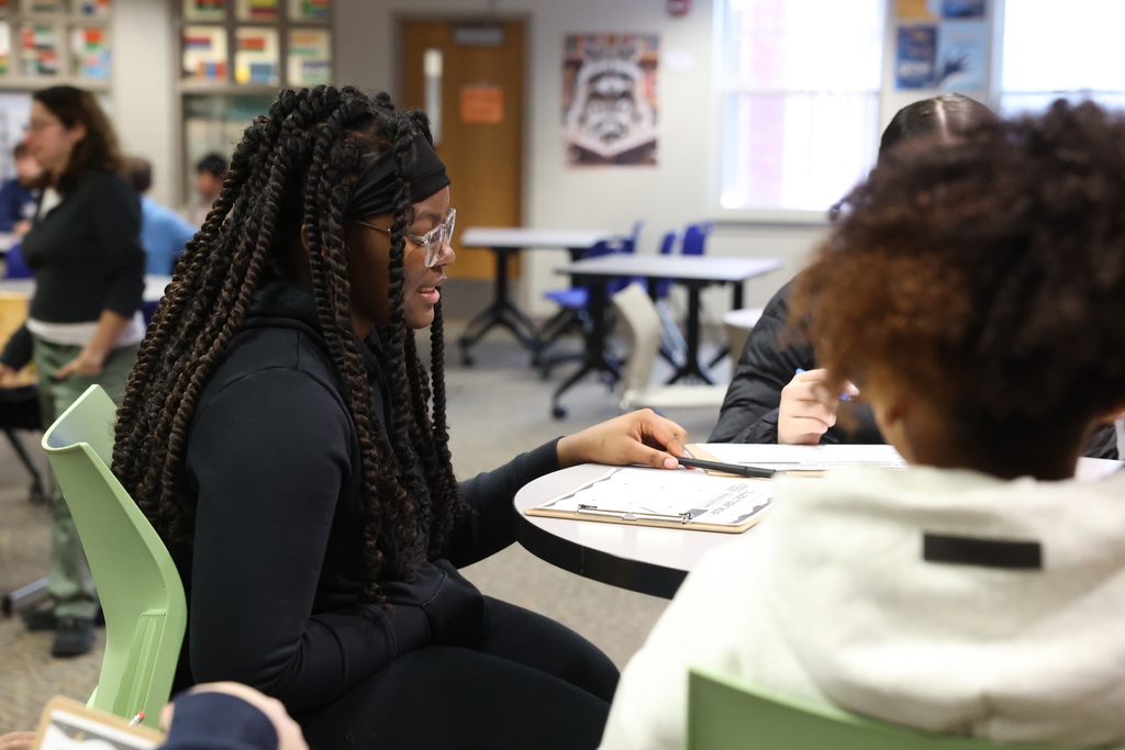 student asks question off of sheet