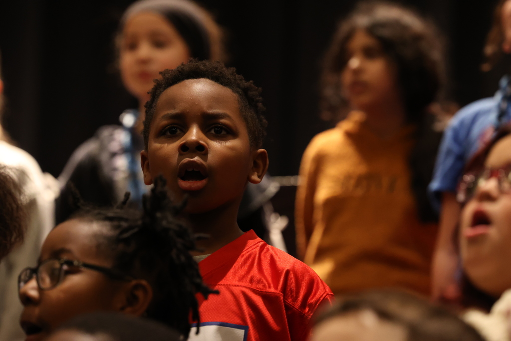 student sings song in chorus