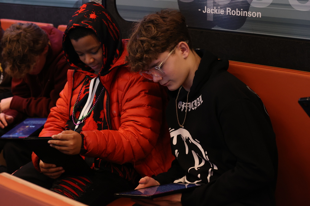 students looks at ipad