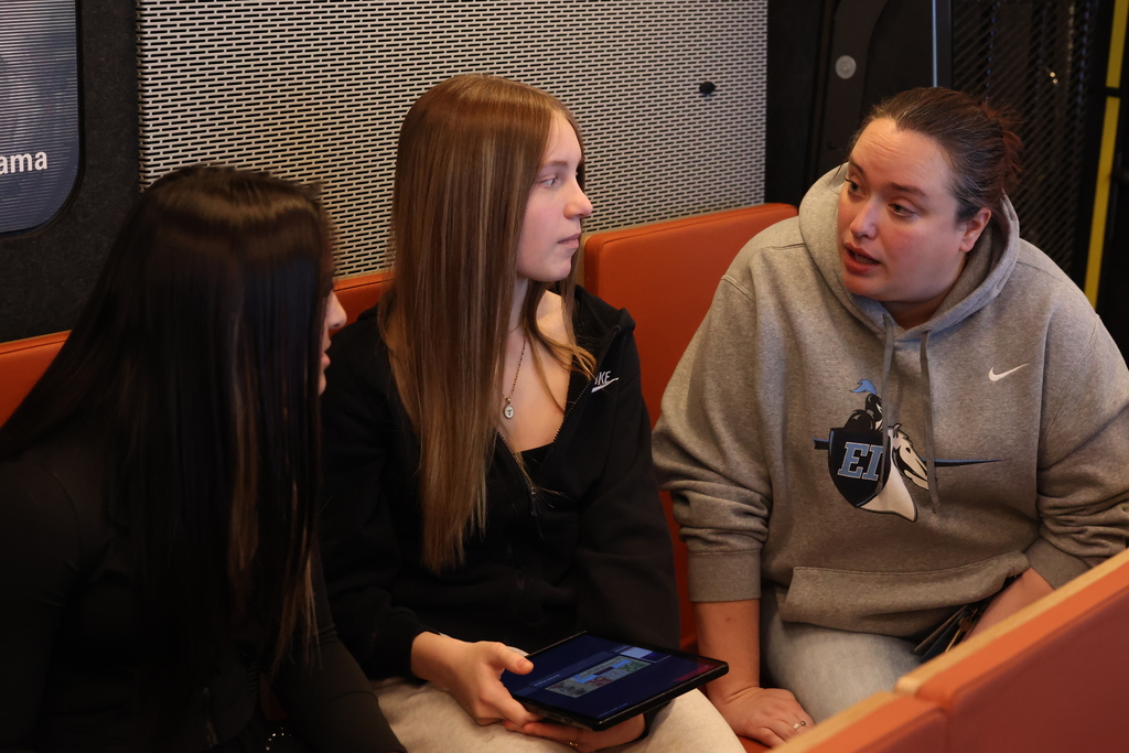 students talk with teacher about material they are seeing on ipads