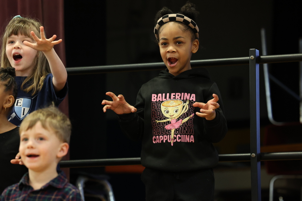 student shows cat hands