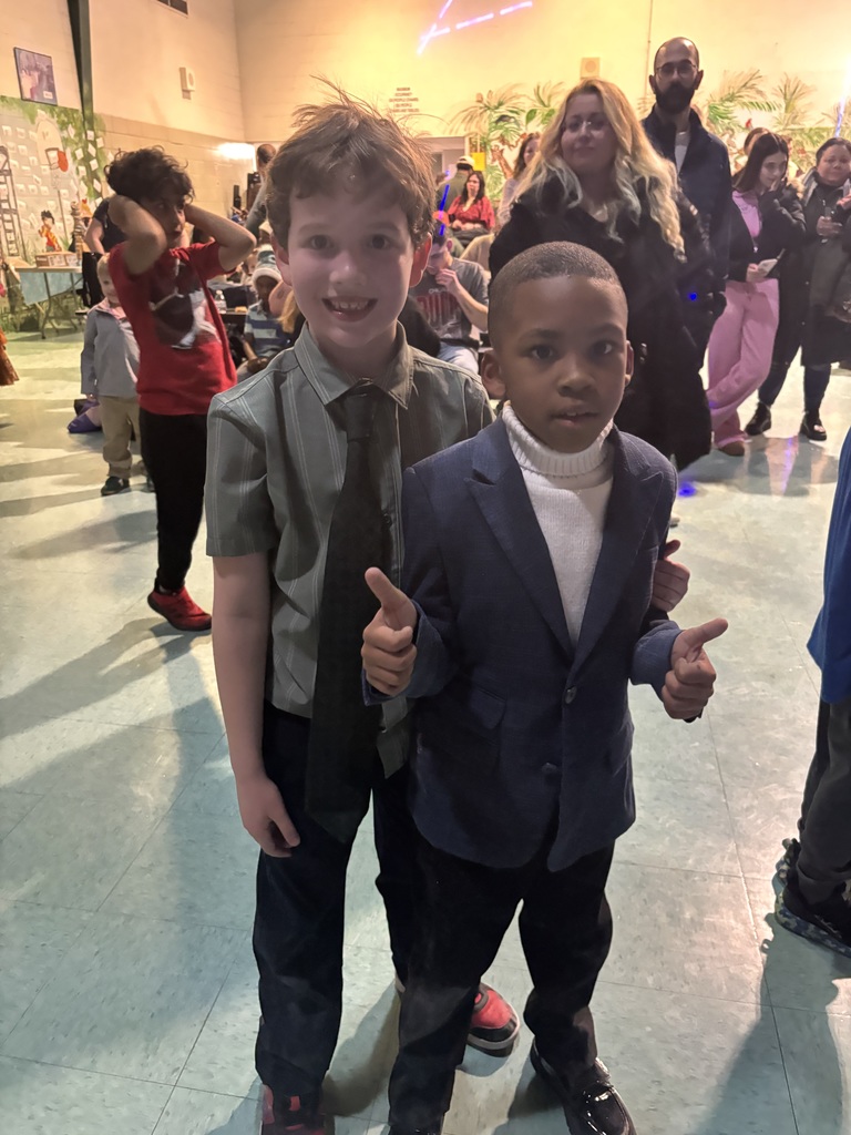 students smile for a photo and give thumbs up