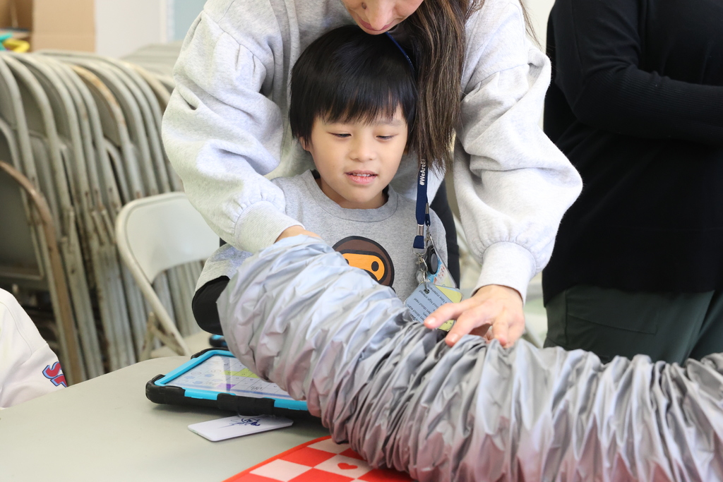 student looks at construction equipment