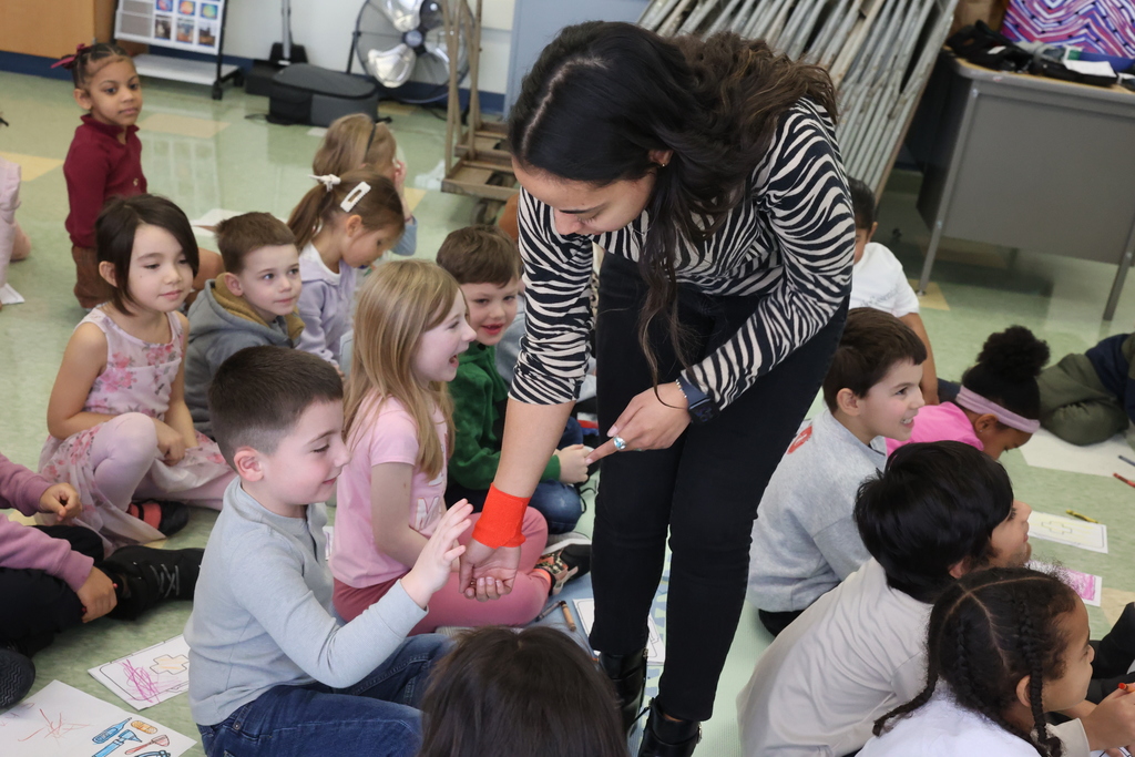 teacher lets students look at her wrist