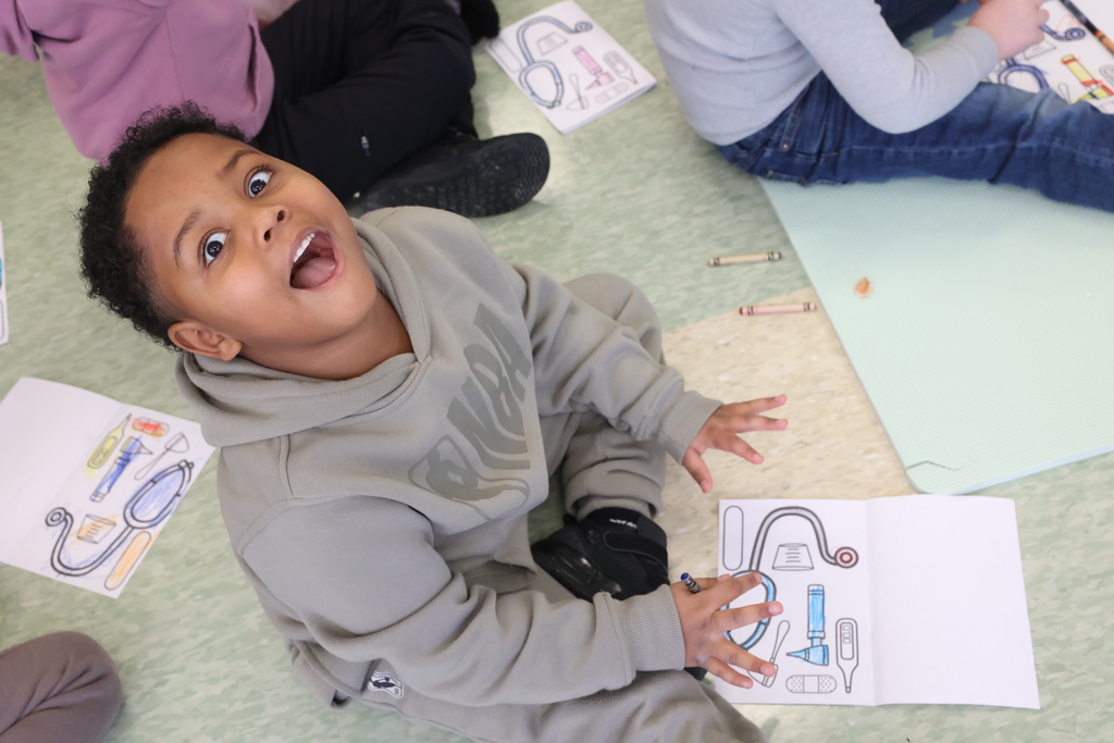 students smiles while coloring